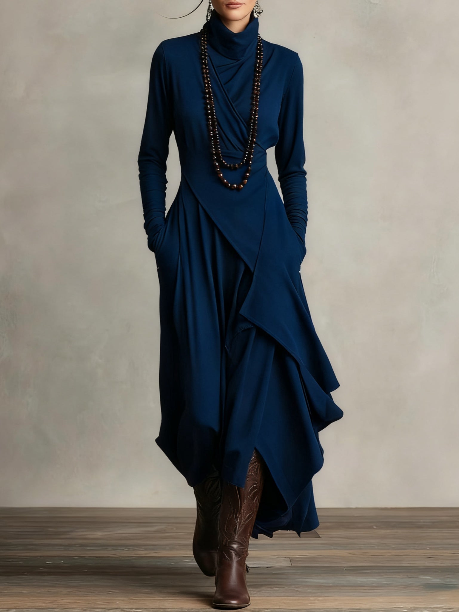 Navy long-sleeve maxi dress with high collar and layered wrap drape