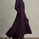 Purple long maxi dress with high neck and cascading draped skirt, side view