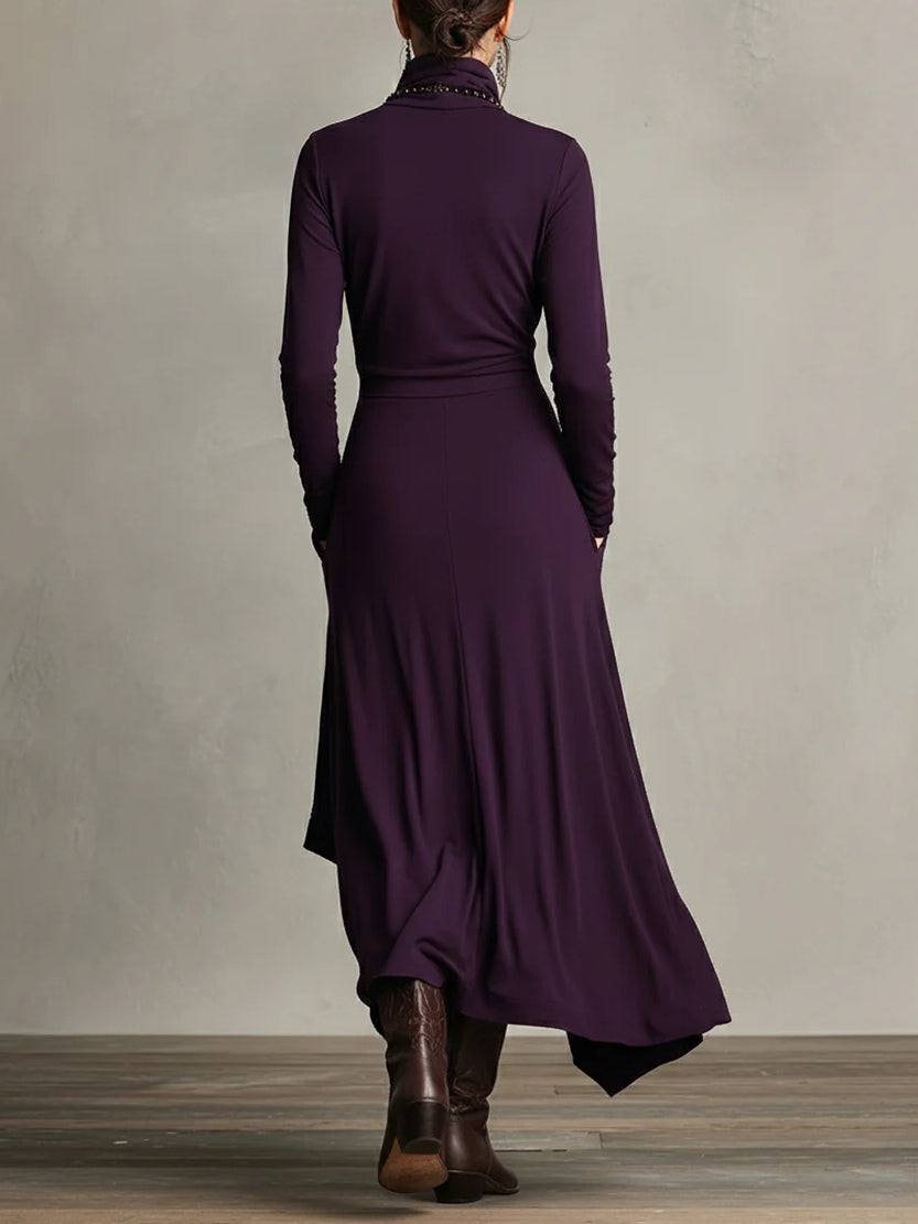 Purple back view maxi dress with long sleeves, high collar, and draped wrap overlay