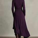 Purple back view maxi dress with long sleeves, high collar, and draped wrap overlay