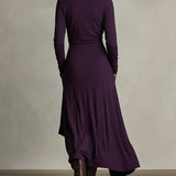 Purple back view maxi dress with long sleeves, high collar, and draped wrap overlay