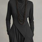 Black long-sleeve maxi dress with high neck, wrapped front and draped overlay