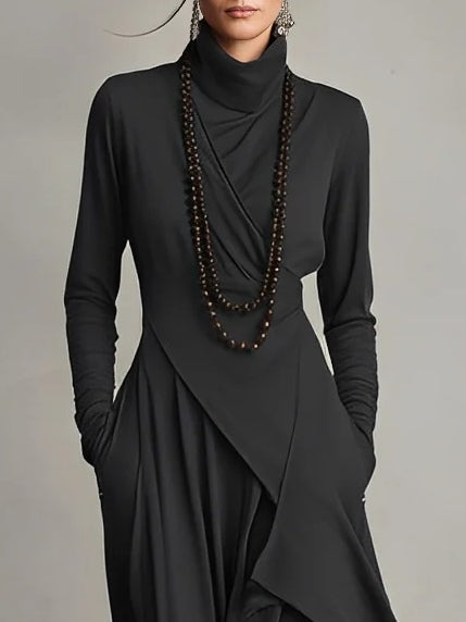 Black long-sleeve maxi dress with high neck, wrapped front and draped overlay