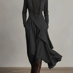 Black long-sleeve maxi dress with high neck and asymmetric layered drape skirt