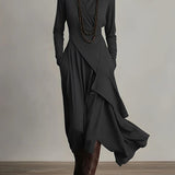 Black long-sleeve maxi dress with high neck and asymmetric layered drape skirt