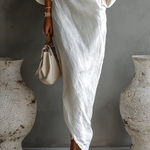 Nelle™ chic white maxi dress, side view with draped waist and three-quarter sleeves