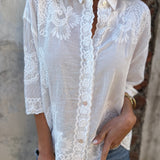 White embroidered long-sleeve cardigan with scalloped lace trim and button placket