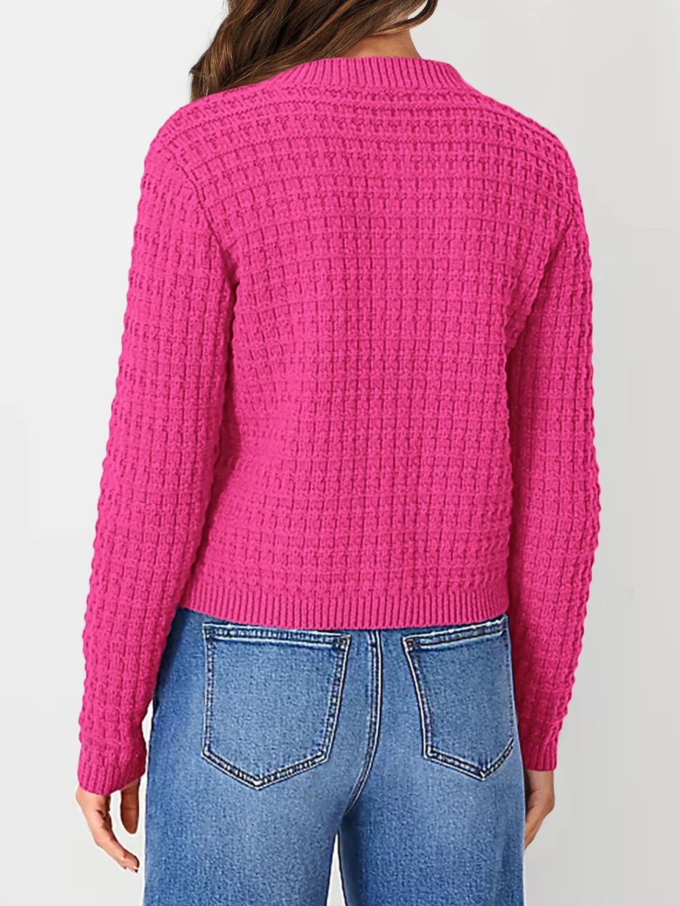 Pink textured knit cardigan, back view with long sleeves and ribbed hem