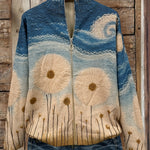 Women's quilted knit zipper jacket in blue and cream with daisy embroidery, front view