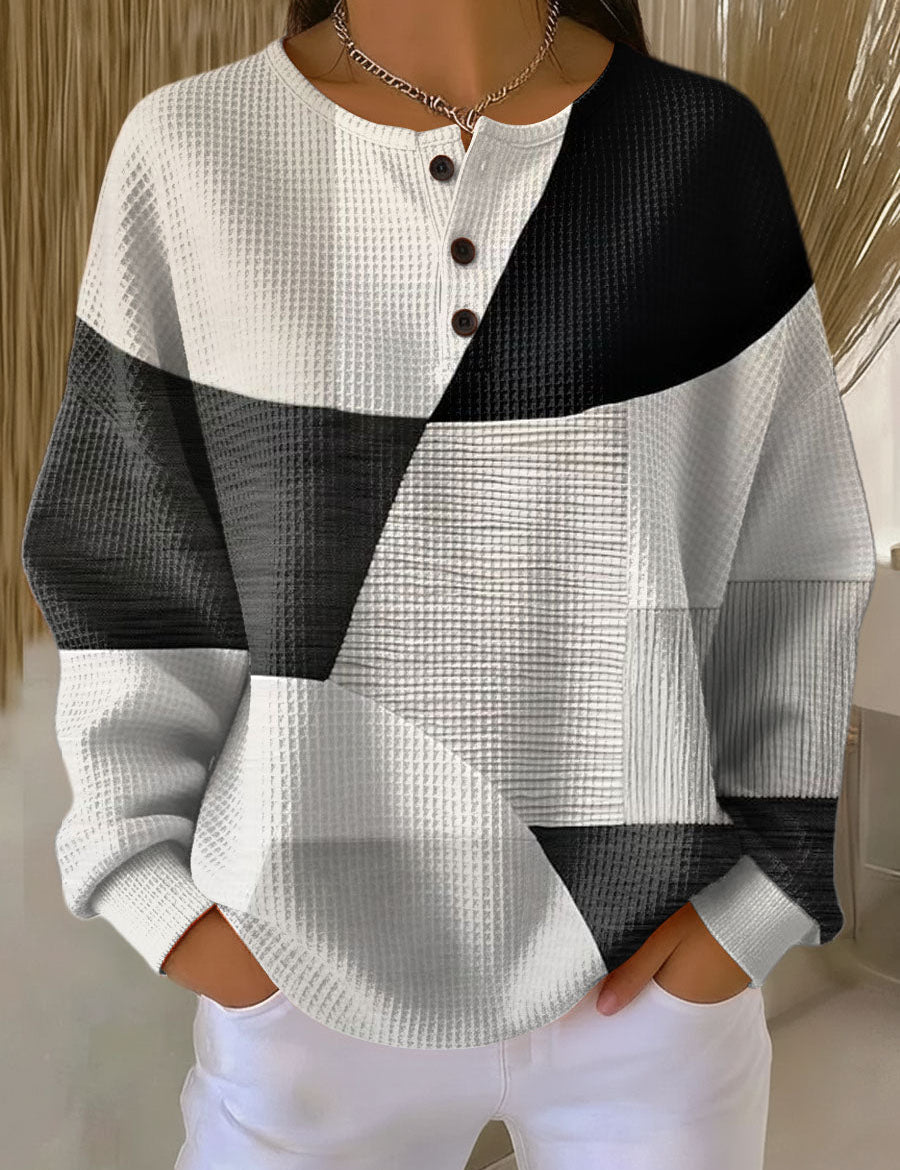 Colorblock long-sleeve henley sweater with black and white panels