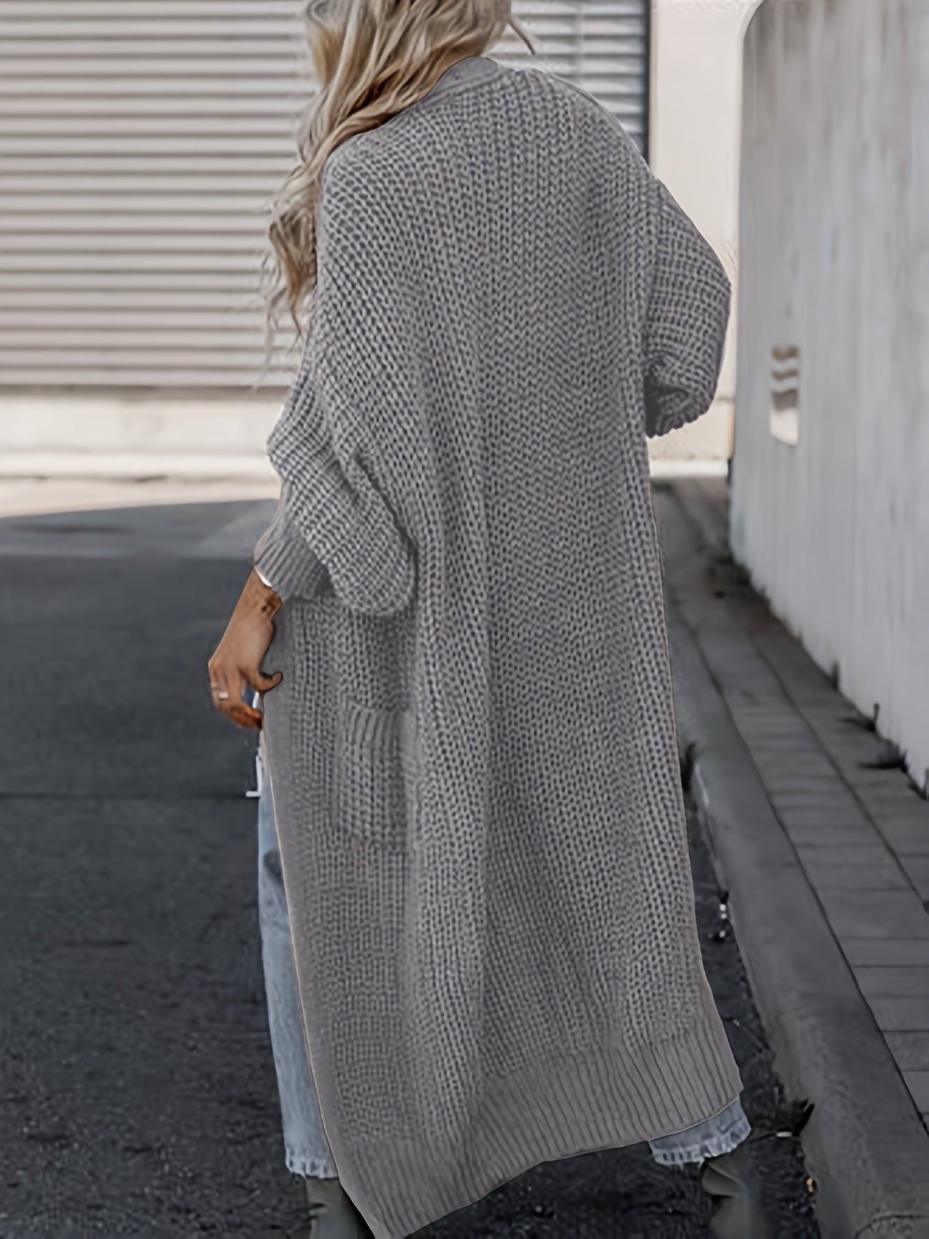 Gray long knit cardigan with open front, long sleeves, and side pockets
