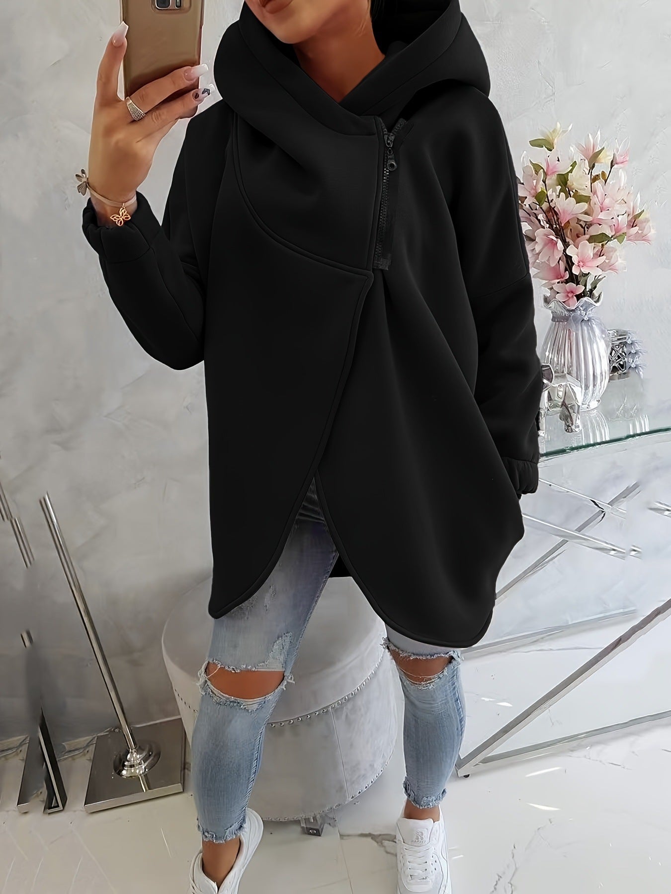 Black zip-up hoodie with hood, front pocket, and center black zipper