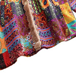 Remi™ patchwork jacket close-up of multicolor patterned fabric and beige sherpa trim