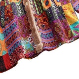 Remi™ patchwork jacket close-up of multicolor patterned fabric and beige sherpa trim