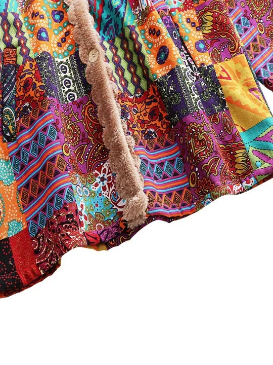 Remi™ patchwork jacket close-up of multicolor patterned fabric and beige sherpa trim