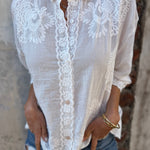 White embroidered long-sleeve cardigan with lace panel and button front, collared