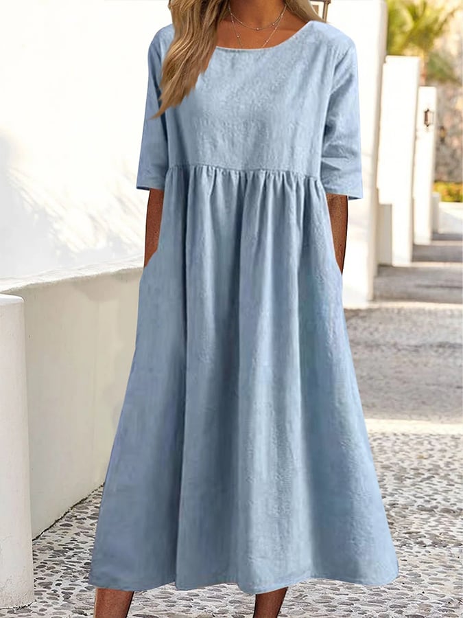 Light blue midi dress with crew neck, 3/4 sleeves, and gathered waist