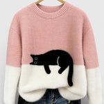 Pink and white two-tone sweatshirt with black cat graphic on the front