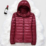 Burgundy hooded puffer jacket with full zipper and quilted front panels