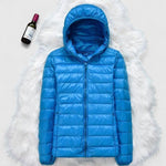 Blue hooded puffer jacket with front zipper and quilted baffles
