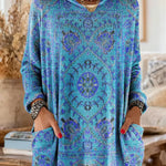 Vintage-inspired hooded knit tunic with front pockets, bright blue multicolor ethnic print
