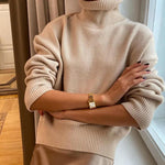 Beige long-sleeve turtleneck knit pullover, ribbed collar and cuffs