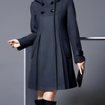 Dark long coat with hood, double-breasted button front, and flap pockets