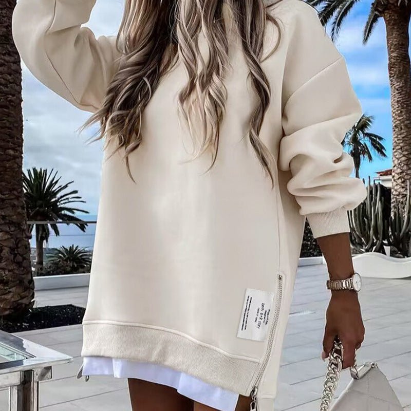 Beige cropped pullover with long sleeves and front zip detail, ribbed hem