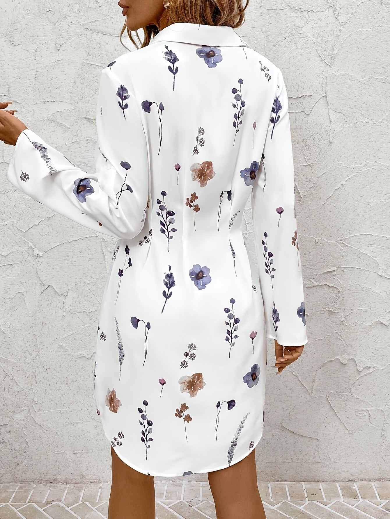 White floral dress back view with button placket and long sleeves
