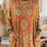 Vintage-inspired hooded knit tunic with front pockets, orange and red multicolor ethnic print