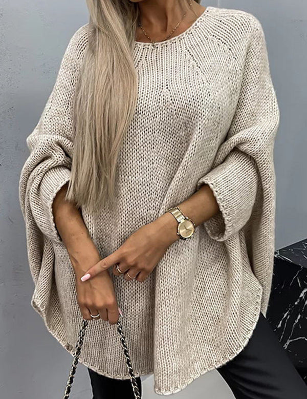Beige knit pullover with textured stitch, wide batwing sleeves and crew neckline