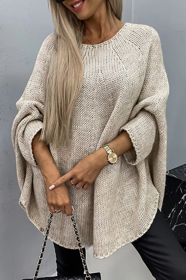 Beige knit pullover with textured stitch, wide batwing sleeves and crew neckline