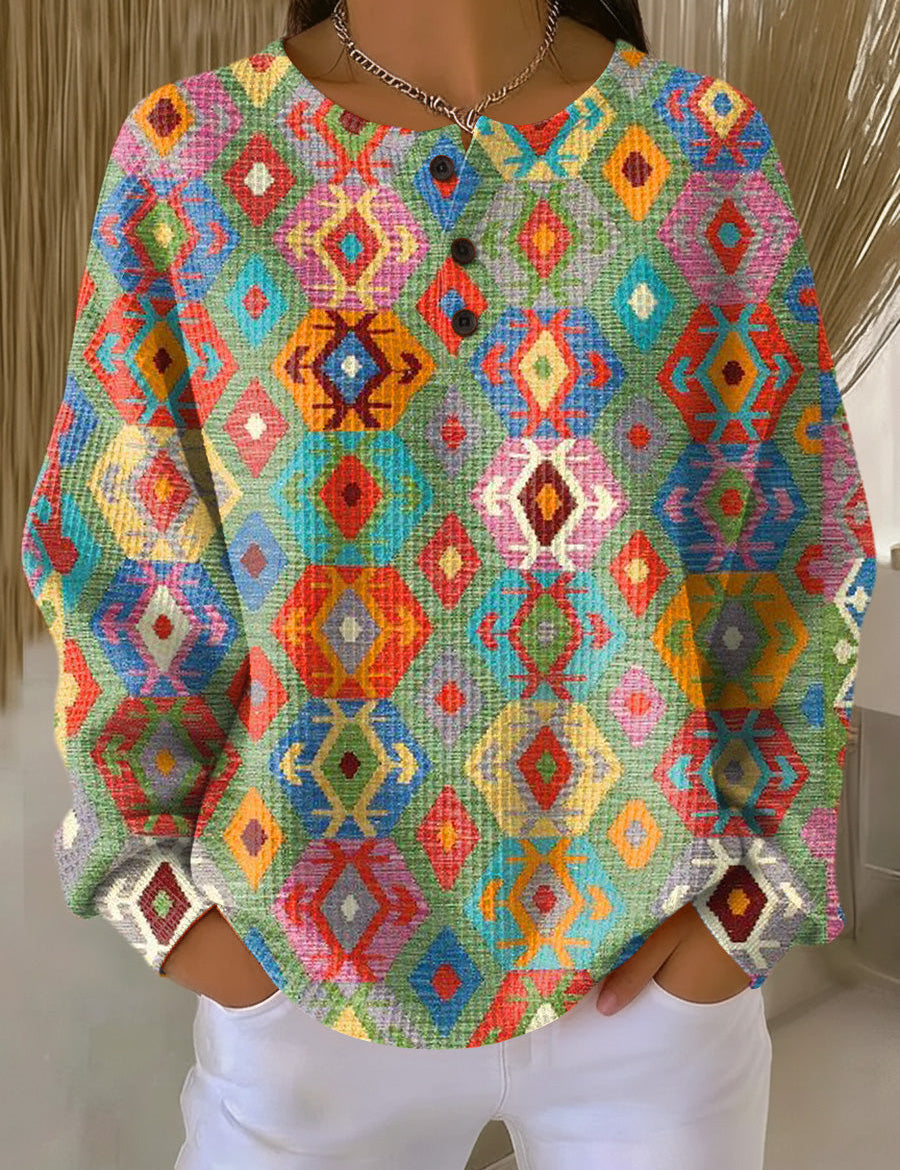 Colorful diamond-pattern pullover sweater with buttoned crew neck