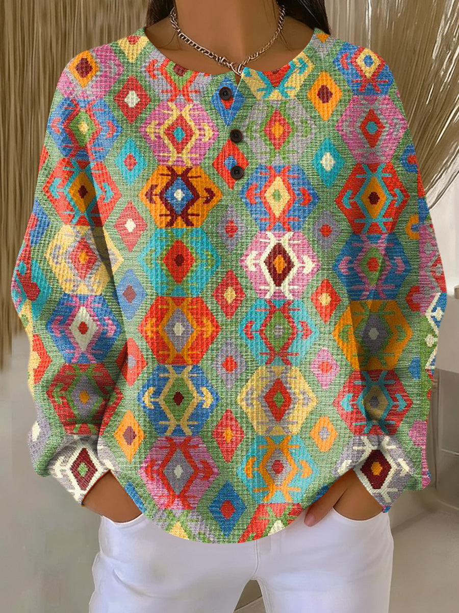 Colorful diamond-pattern pullover sweater with buttoned crew neck