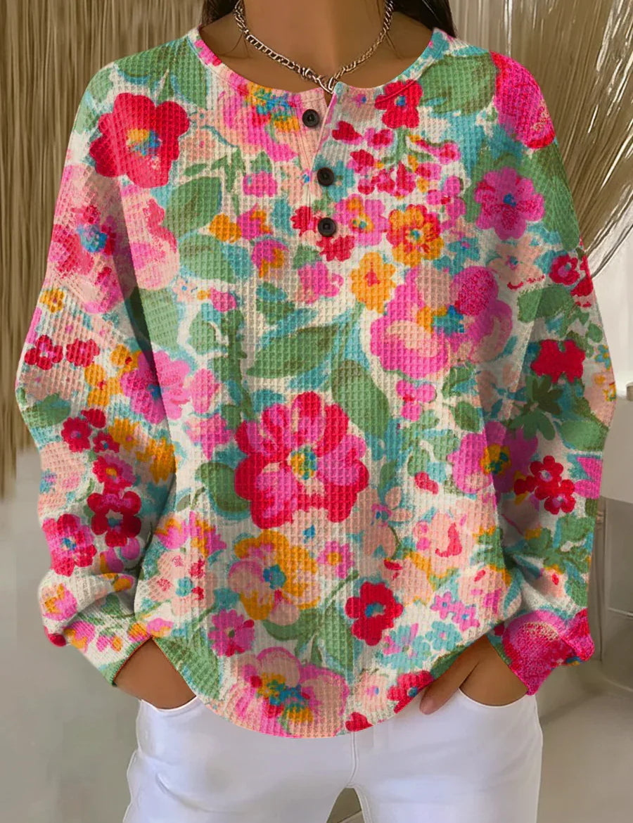 Soft knit pullover with multicolor floral print, long sleeves, button placket