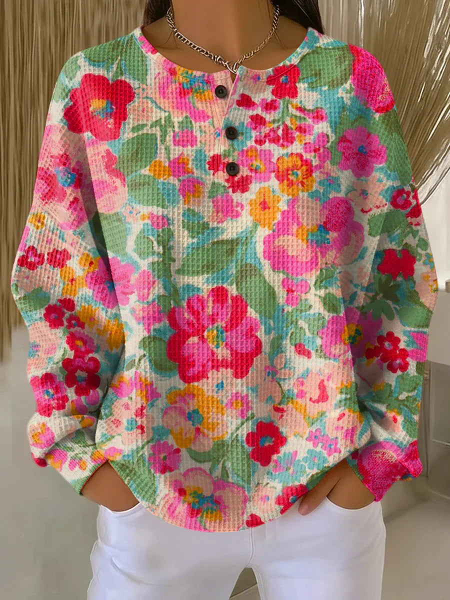 Soft knit pullover with multicolor floral print, long sleeves, button placket