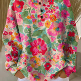 Soft knit pullover with multicolor floral print, long sleeves, button placket