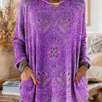 Purple hooded knit tunic with long sleeves, front pockets, and ornate ethnic print