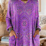 Purple hooded knit tunic with long sleeves, front pockets, and ornate ethnic print