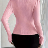 Pink ribbed knit long-sleeve top with rounded back and fitted waist