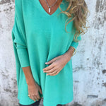 Teal V-neck pullover sweater with three-quarter sleeves and relaxed fit.