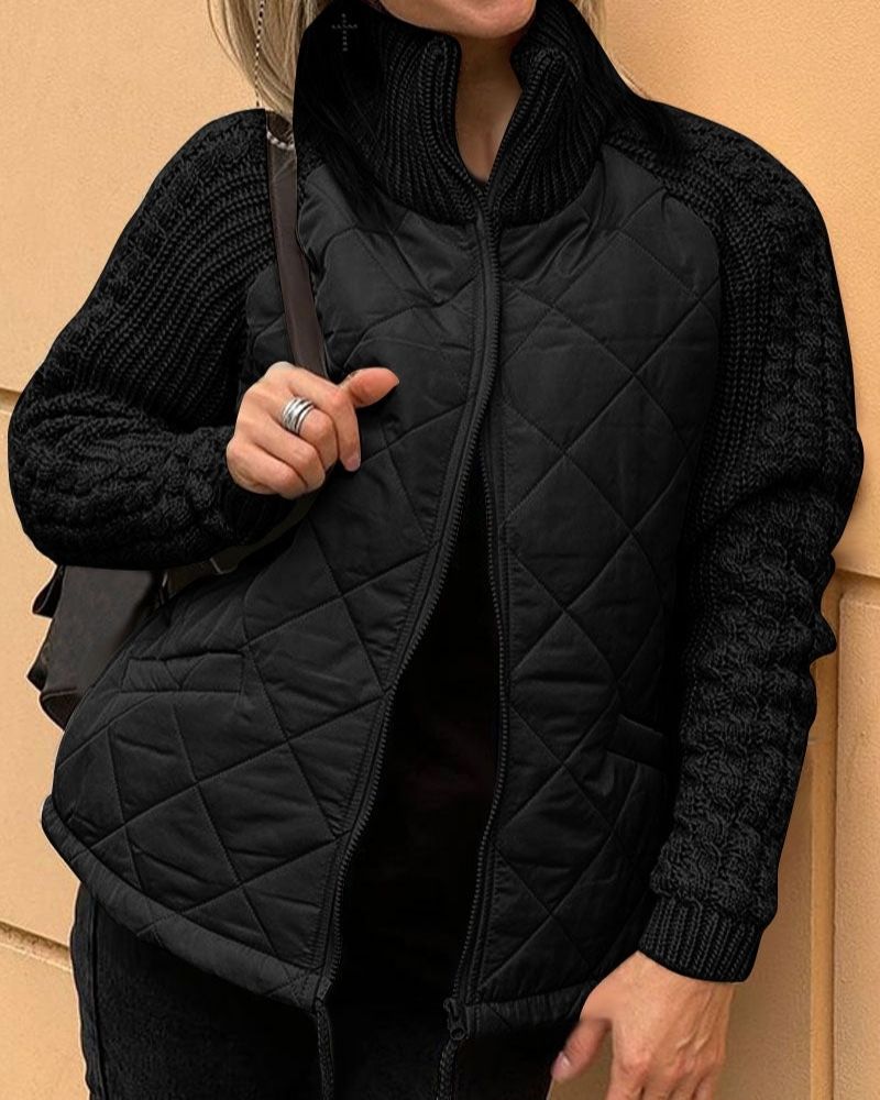 Black quilted cardigan vest with long knit sleeves and front zipper