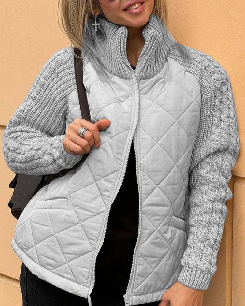 Light gray quilted cardigan vest with front zipper and textured gray knit sleeves