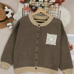 Dark brown knit cardigan, button front, ribbed hem and cuffs, long sleeves, crochet pocket