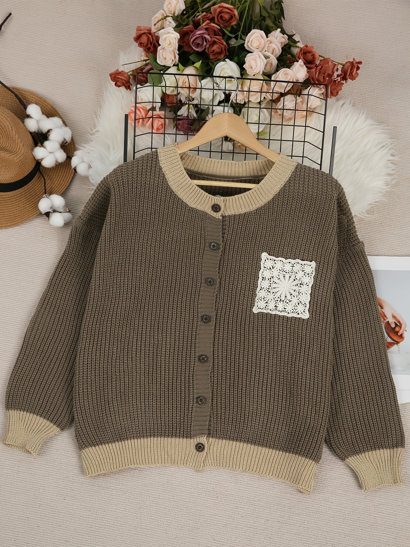 Dark brown knit cardigan, button front, ribbed hem and cuffs, long sleeves, crochet pocket