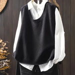 Black sleeveless knit Grace cardigan with ribbed cowl neck and button placket