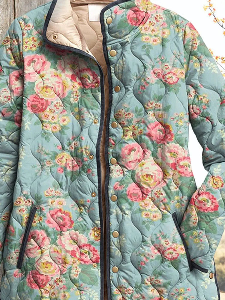 Quilted floral women’s jacket close-up, teal-blue with roses, button placket and trim