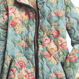 Quilted floral women’s jacket close-up, teal-blue with roses, button placket and trim