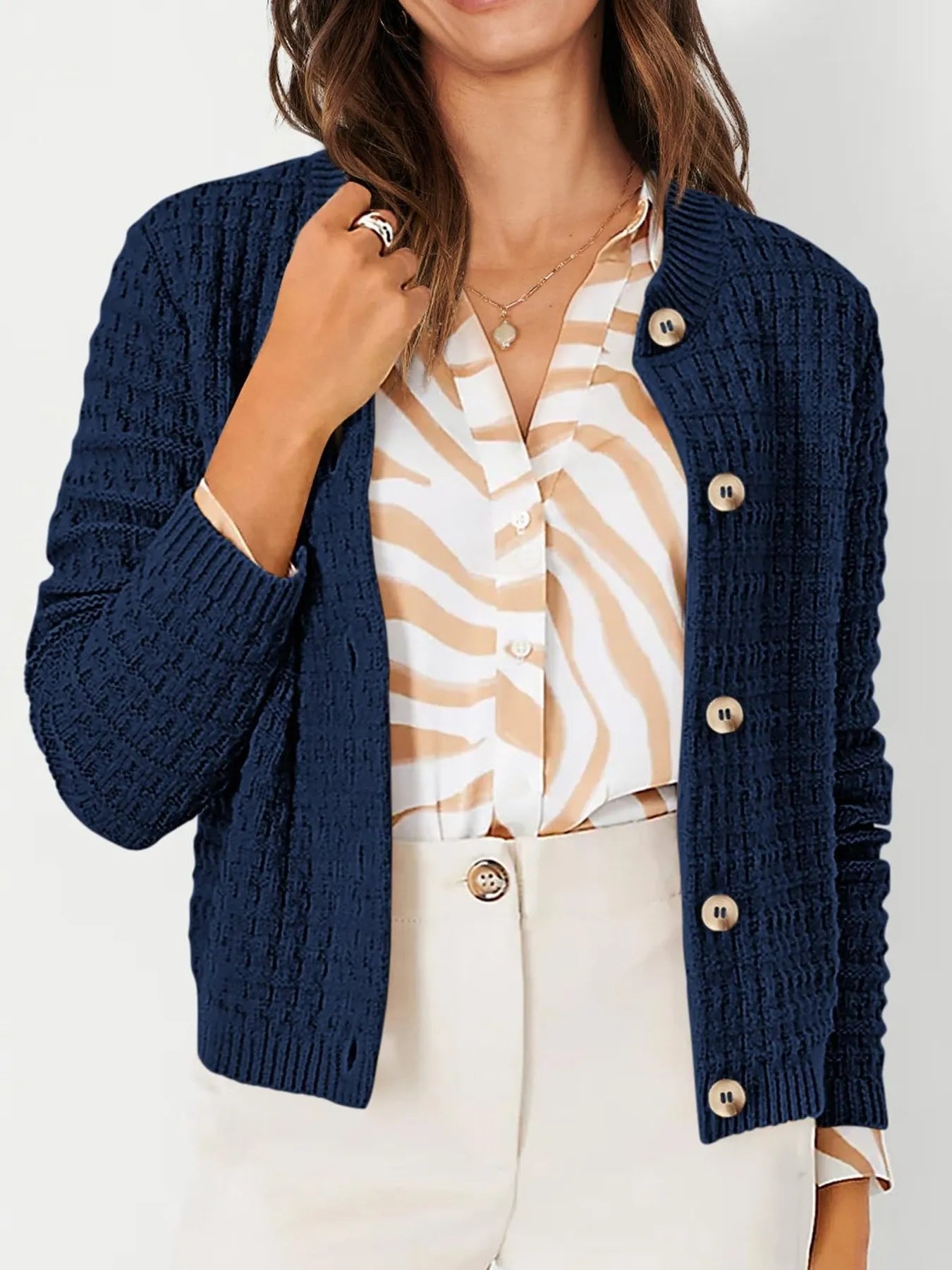 Navy textured knit cardigan with button front, mock placket, and long sleeves