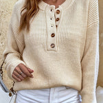 Beige knit pullover henley sweater with button-front placket and ribbed cuffs